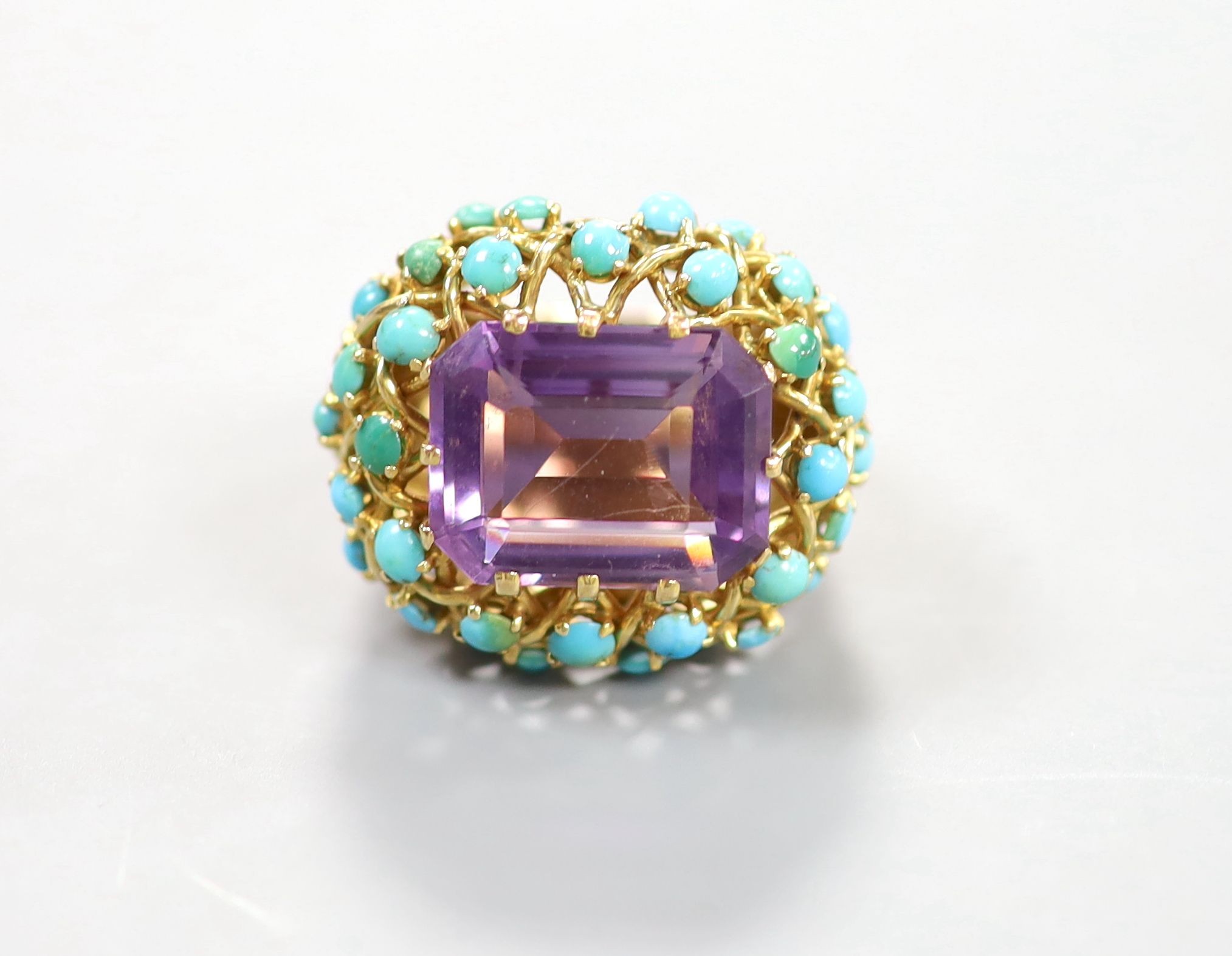 A French yellow metal (18ct poincon mark), amethyst and turquoise set cluster dress ring, with ribbed shank, size J, gross weight 19.2 grams.